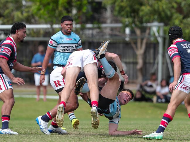 Thomas Dellow up-ended in a heavy tackle. Picture: Adam Wrightson Photography