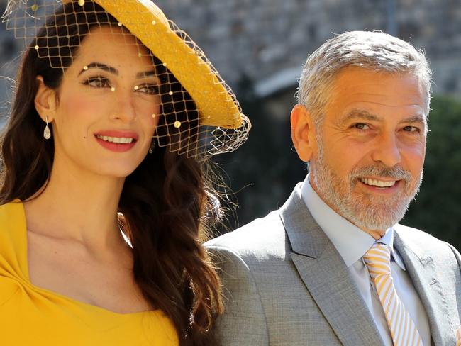 Amal Clooney and US actor George Clooney arrive for the wedding ceremony of Britain's Prince Harry, Duke of Sussex and US actress Meghan Markle at St George's Chapel, Windsor Castle, in Windsor, on May 19, 2018. / AFP PHOTO / POOL / Gareth Fuller