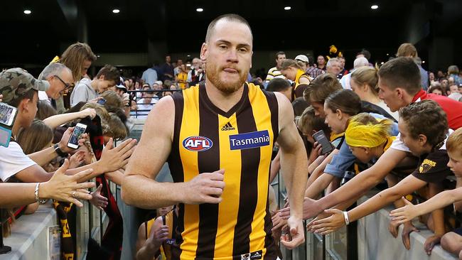 Roughead leads the Hawks out for the first time as captain. Picture: George Salpigtidis