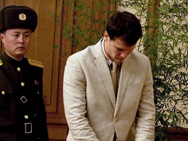 American student Otto Warmbier, center, arrives at the People's Cultural House, as Warmbier is presented to reporters Monday, Feb. 29, 2016, in Pyongyang, North Korea. North Korea announced late last month that it had arrested the 21-year-old University of Virginia undergraduate student. (AP Photo/Kim Kwang Hyon)