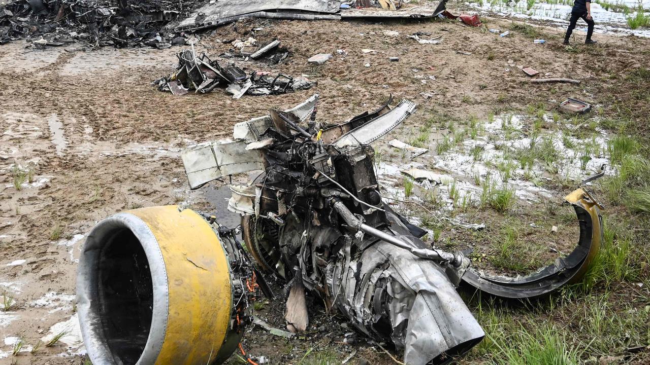 Officials examine the site after a Saurya Airlines' plane crashed during takeoff at the Tribhuvan International Airport in Kathmandu. Picture: PRAKASH MATHEMA / AFP