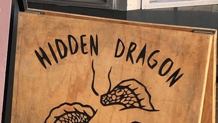 A sign for Hidden Dragon Massage in Lawrence St, Freshwater. One of its former employees was convicted of sexually touching a female client.