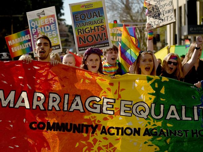 Same-sex marriage supporters rally in Sydney. Picture: AFP/Peter Parks