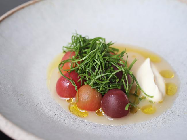 Franklin restaurant’s cherry tomatoes, with vinaigrette and sorrel, which comes served in a cold tuna broth, has been described as “truly divine”. Picture: NIKKI DAVIS-JONES