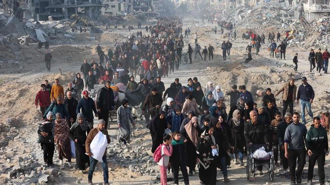 Displaced Palestinians trying to return home on Sunday in northern Gaza. Picture: Omar Al-Qatta/AFP