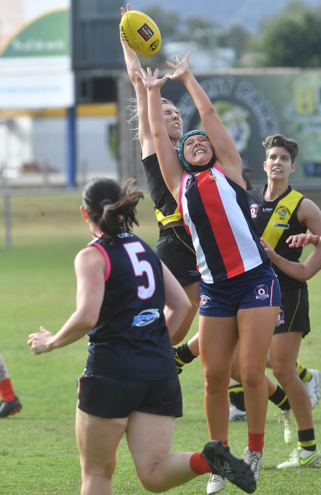 Womens AFL game between Curra Swans and Hermit Park Tigers at Murray. Tigers Maggie Evans and Swans Breht Wyke. Picture: Evan Morgan