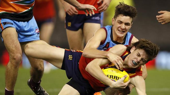 Errol Gulden tackles Will Day in an Allies match against South Australia.