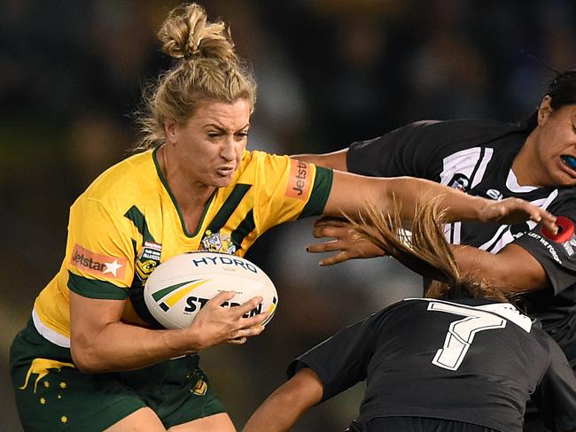 Ruan Sims palms off a tackle by Maitua Feterika.