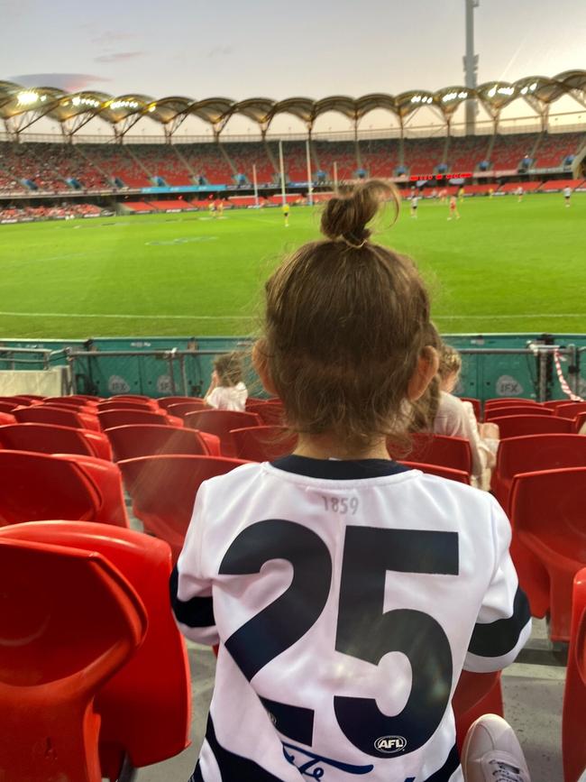 Klodinsky’s toddler in a Cats jersey at one of the games.