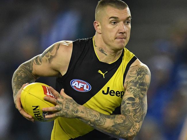 Dustin Martin of the Tigers (left) is seen in action during the Round 11 AFL match between the North Melbourne Kangaroos and the Richmond Tigers at Etihad Stadium in Melbourne, Saturday, June 3, 2017. (AAP Image/Julian Smith) NO ARCHIVING, EDITORIAL USE ONLY