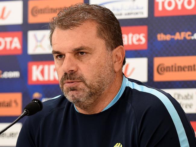 Australia's head coach Ange Postecoglou (R) answers questions beside player Mark Milligan during a press conference at Saitama Stadium in Saitama on August 30, 2017. Australia will play Japan in a World Cup 2018 qualifying football match in Saitama on August 31. / AFP PHOTO / Toru YAMANAKA