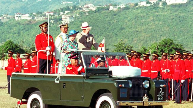 The Queen and Philip inspecting members of the Second Battalion of the Jamaica Regiment in 1962. Picture: Martin Keene – PA Images/Getty Images