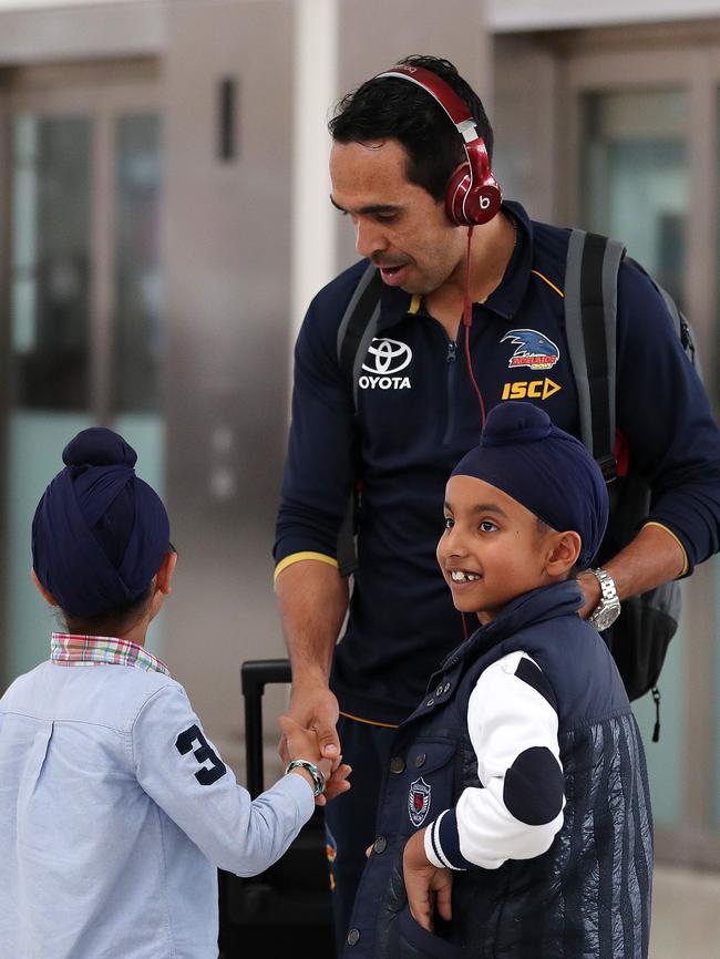 Crows star Eddie Betts with young fans Samar and Darsh Singh. Picture: Dylan Coker