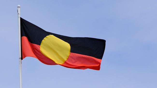 The Aboriginal flag is seen at the Victorian parliament building. Picture: NewsWire / Luis Enrique Ascui.