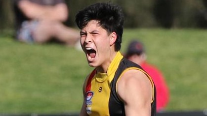 Josh Lai celebrates one of his two semi final goals this September. Picture: Andrew Keech.