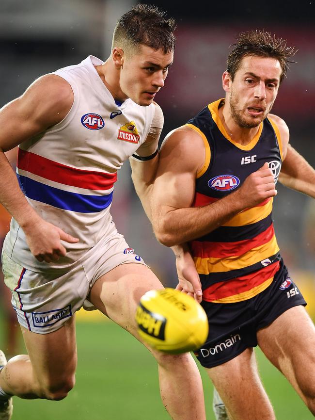 Richard Douglas tries to bump out Western Bulldog Matt Suckling out of the way on Friday. Picture: Mark Brake/Getty Images