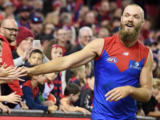 MELBOURNE, AUSTRALIA - APRIL 29:  Max Gawn of the Demons high fives fans after winning the round 6 AFL match between the Essendon Bombers and Melbourne Demons at Etihad Stadium on April 29, 2018 in Melbourne, Australia.  (Photo by Quinn Rooney/Getty Images)