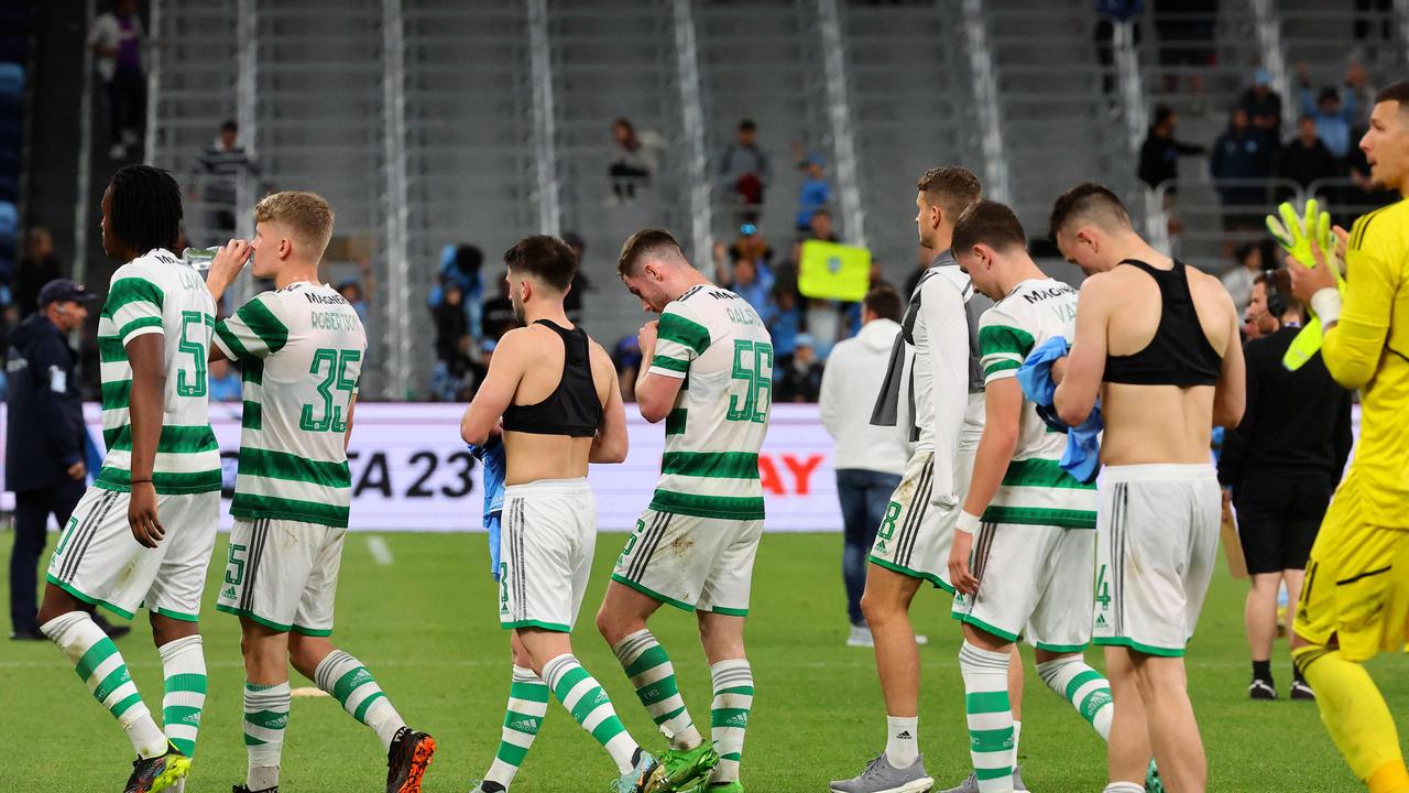 A dejected Celtic team leaves the field after losing to Sydney FC Picture: DAVID GRAY / AFP