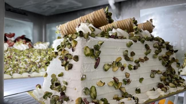 A glamorous pistachio log cake.