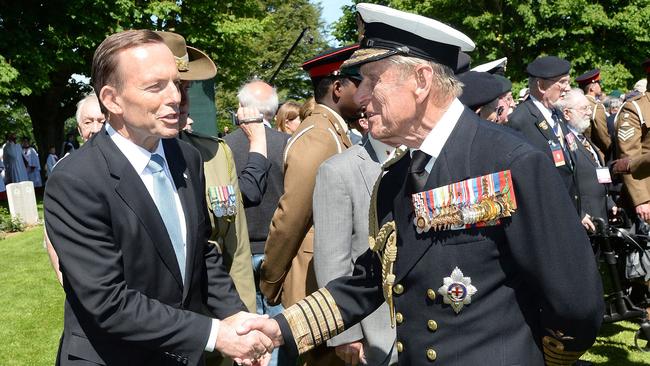 Then prime minister Tony Abbott meets Prince Philip, Duke of Edinburgh, in 2014 at the Service of Remembrance at Bayeux cathedral, France, during D-Day 70 Commemorations.