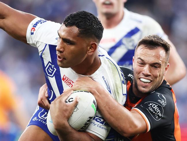 SYDNEY, AUSTRALIA - JUNE 19:  Tevita Pangai Junior of the Bulldogs is tackled by Luke Brooks of the Tigers during the round 15 NRL match between the Canterbury Bulldogs and the Wests Tigers at CommBank Stadium, on June 19, 2022, in Sydney, Australia. (Photo by Matt King/Getty Images)