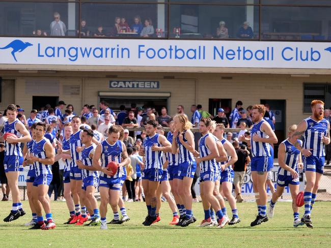 Langwarrin players warm up before facing Chelsea on Saturday. Picture: Paul Churcher.