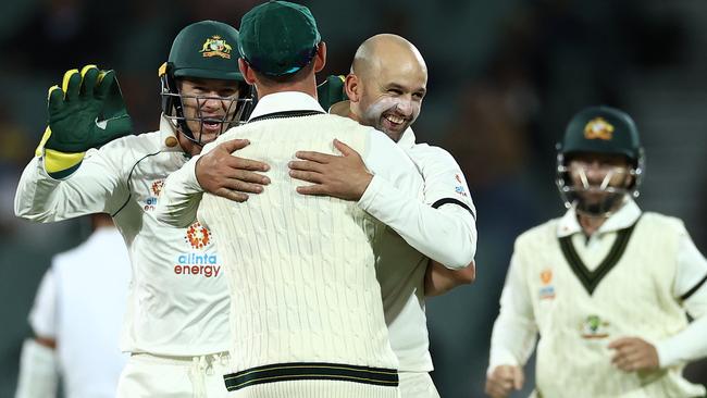 Nathan Lyon celebrates with Josh Hazlewood on day one of the first Test against India in Adelaide. Picture: Getty Images