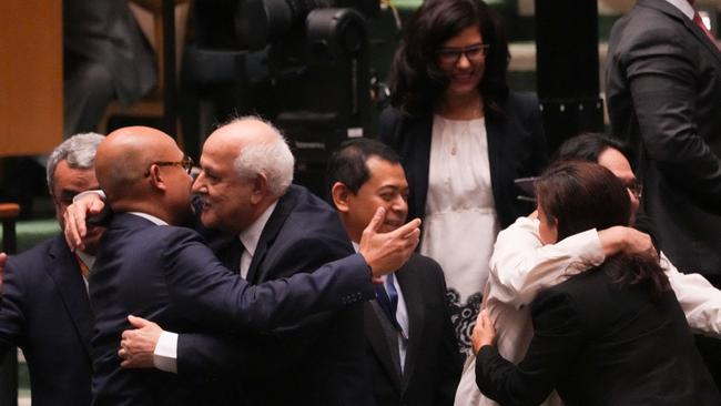 Palestinian representative Ryad Mansour, centre, is congratulated after the UN General Assembly vote. Picture: AFP