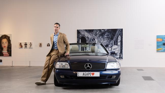 Michael Zavros with his Mercedes which he transformed into an art installation titled Drowned Mercedes 2023.