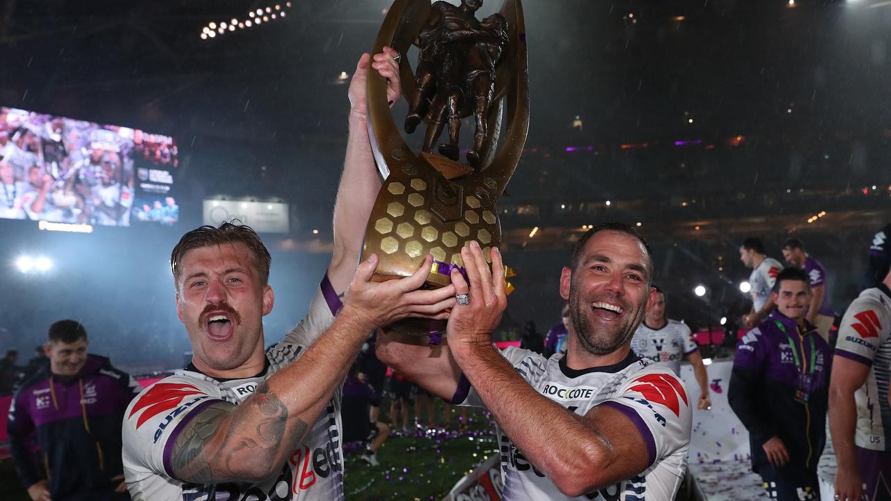 Munster and Cameron Smith celebrate victory after the 2020 NRL grand final. Picture: Brett Costello