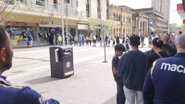 Eels fans line up to grab some merchandise at Peter Wynn’s store.