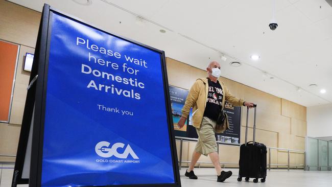 Passengers arrive off the last South Australian flight into the Gold Coast before borders close to South Australia. Picture: Scott Powick.