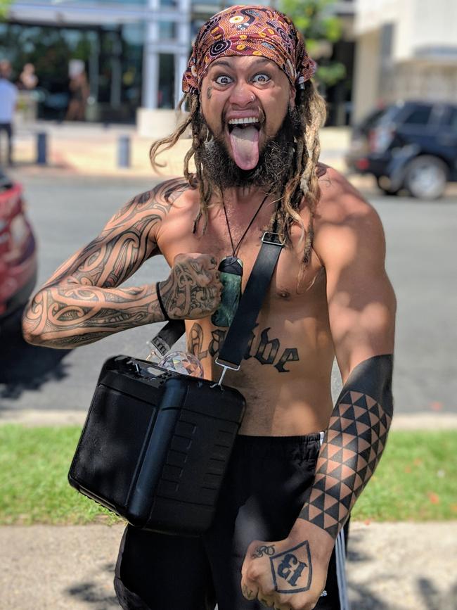 Gold Coast Maori man Rah Tamati captures attention dancing along to a portable speaker outside Southport Courthouse.