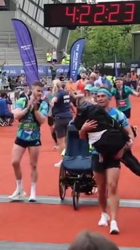 Rugby Legend Helps His Friend Across Marathon Finish Line