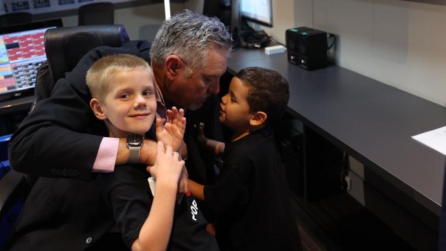 Ray’s grandchildren hug their beloved “Poppy”. Picture: Rohan Kelly