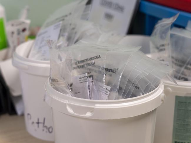 Tests in buckets destined for the pathology laboratory. Image Matthew Vasilescu