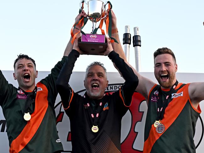 Keilor ParkÃs captains Robert Castello and Daylan Kempster with coach Paul Guicas after winning the EDFL Division 2 Grand Final between Keilor Park and Oak Park in Essendon, Saturday, Sept. 3, 2022. Picture: Andy Brownbill