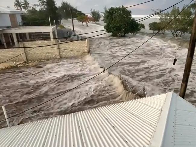 Dramatic footage shows waves rolling through coastal Tongan homes following the eruption which has engulfed the coasts of Nuku’alofa. Picture Twitter/@sakaimoana