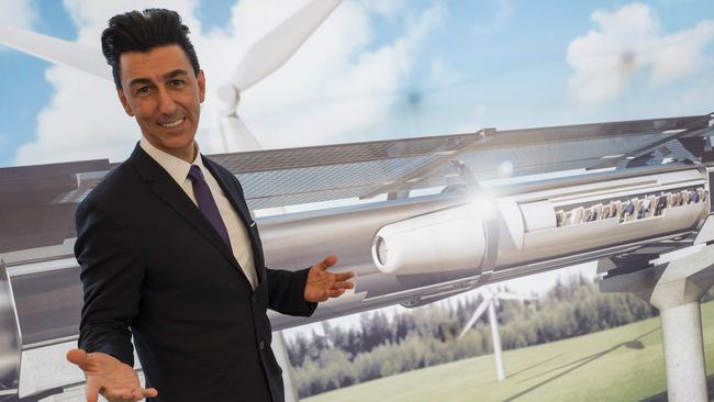 Chairman of Hyperloop Transportation Technologies Inc Bibop Gresta poses in front of a rendering of the Hyperloop technology at Innotrans, the railway industry’s largest trade fair, in Berlin. Picture: John Macdougall