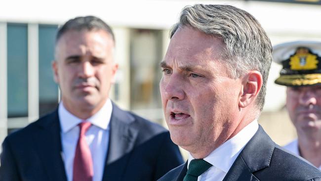 Premier Peter Malinauskas (left) watches Defence Minister Richard Marles (centre) addressing the media in March, after signing a co-operation agreement to build the AUKUS submarines at the Osborne Naval Shipyard. Picture: NCA NewsWire / Brenton Edwards