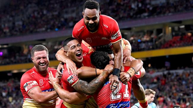 BRISBANE, AUSTRALIA - MAY 06: Valynce Te Whare of the Dolphins celebrates with his team mates after scoring a try during the round 10 NRL match between Cronulla Sharks and Dolphins at Suncorp Stadium on May 06, 2023 in Brisbane, Australia. (Photo by Bradley Kanaris/Getty Images)