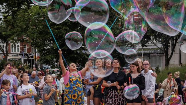 Members of the community gather to mourn the three young victims. Picture: Dan Kitwood/Getty Images