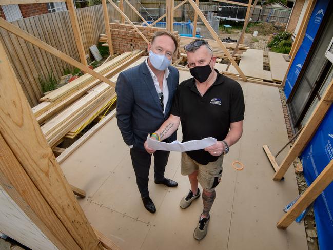 Builder Richard McCoid (in suit) and Senior Project Manager, Nick Uren, from Extensions Unlimited with a foreman on a half completed site in Lysterfield.Picture: Jay Town