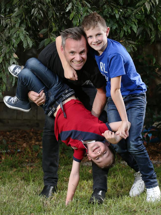 Dad Justin Phillips and his boys Luke and Toby. Picture: David Crosling