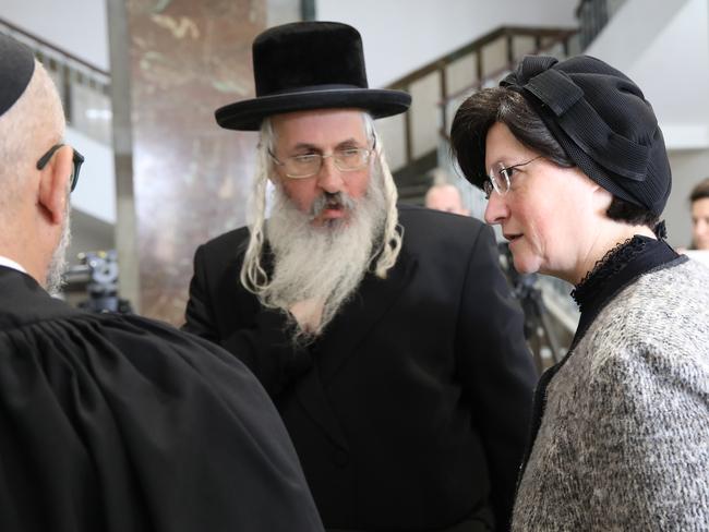 Malka Leifer's brother and sister speak to defence lawyer Tal Gabay. Picture: Ella Pellegrini