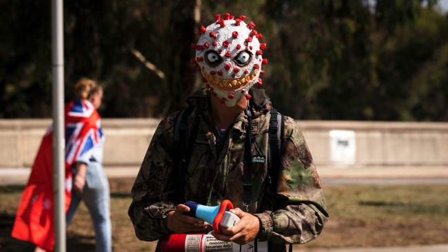 A man dressed as a coronavirus. Picture: Brook Mitchell/Getty Images