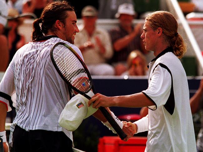 Australian tennis player Pat Rafter shaking hands with Lleyton Hewitt after a match at White City, 12 Jan 1999.