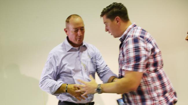 Senator Fraser Anning cleans egg off himself. Picture: AAP Image/David Crosling