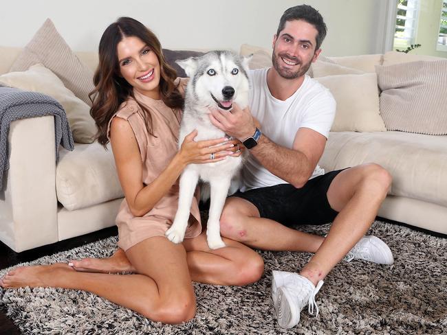 Ben Cutting quickly came around to the idea of having a dog with fiance Erin Holland. Picture: Richard Gosling