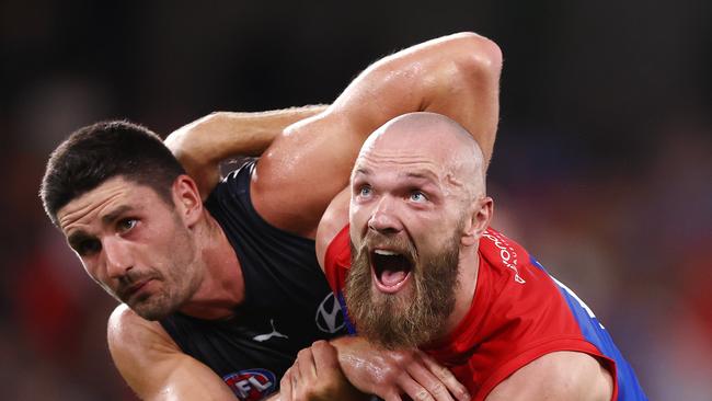 Max Gawn of the Demons wrestles with Marc Pittonet.